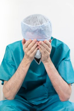 A surgeon exhausted by his work.