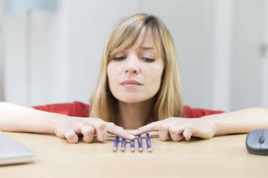 Woman suffering from symmetry and orderliness OCD.