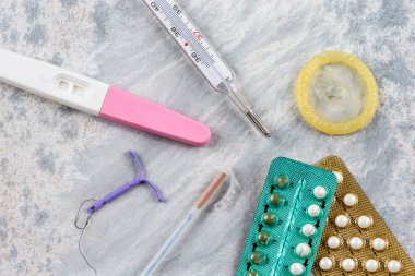 Close-up of IUDs, birth control pills and other means of contraception.