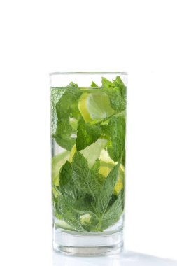 Cold and refreshing detox water with lime, cucumber, mint leaves and ice in glass jar.