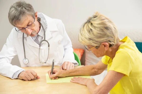Physician Doing Writing Rehabilitation Woman Parkinson Disease — 스톡 사진