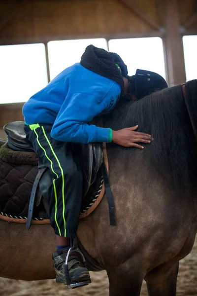 Equitherapy session for an autistic in an equestrian center.