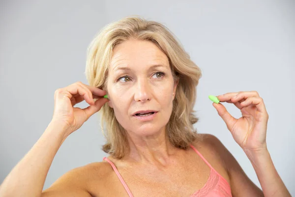 Woman Using Earplugs Close — Stok fotoğraf