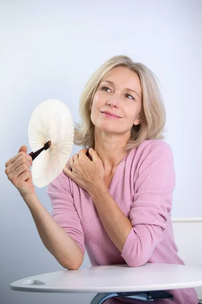 Menopausal Woman Having Hot Flush — Stockfoto