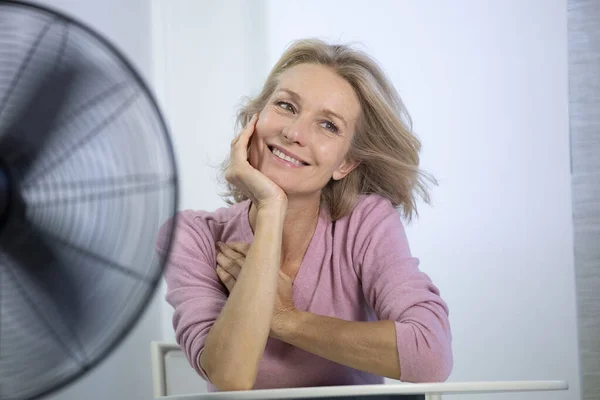 Menopausal Woman Having Hot Flush — Stockfoto