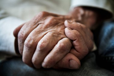 Close-up of the hands of an elderly man.