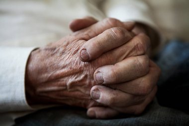 Close-up of the hands of an elderly man.
