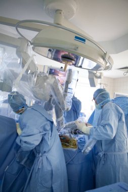 Robot surgeon performing prostatectomy, prostate removal.