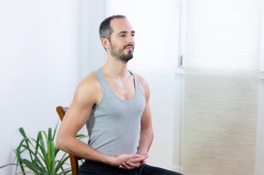 A man carrying out relaxation techniques.