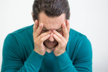 Depressed man on studio background