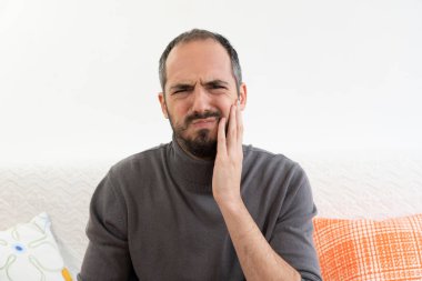 A man with tooth ache.