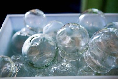 Therapist specializing in traditional Chinese medicine practicing the application of suction cups to strengthen the vascularization.