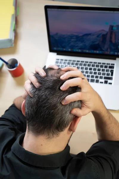 Man Holding His Head His Hands Front His Computer — Stok fotoğraf