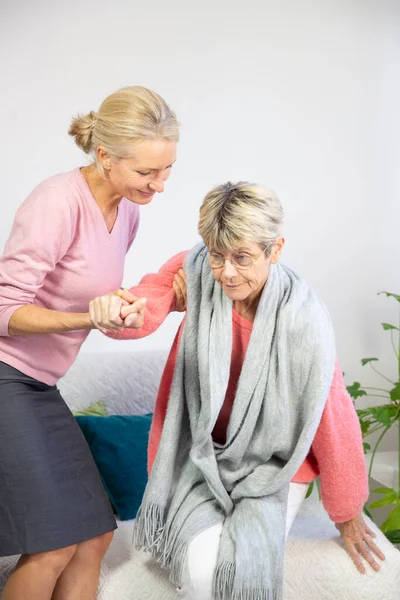 Woman Her Fifties Helping Elderly Woman Stand — Stock Fotó