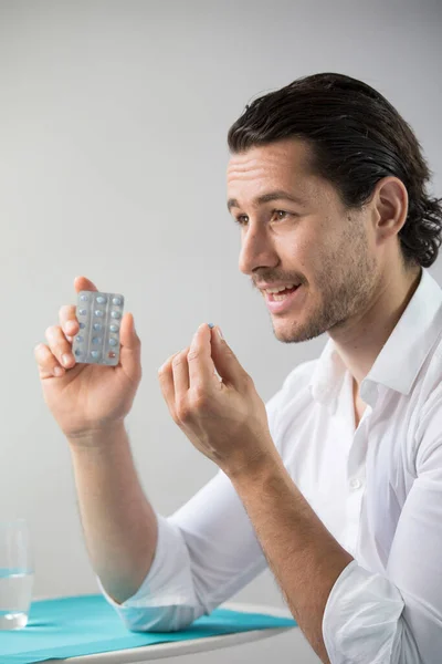 Man Taking Contraceptive Pill — Stok fotoğraf