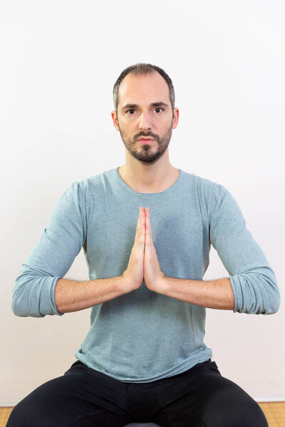 A man carrying out relaxation techniques.