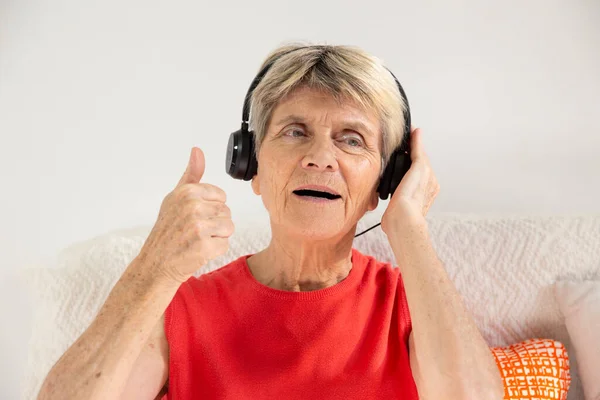 Woman Expressing Joy While Listening Music Headphones — Stock Photo, Image