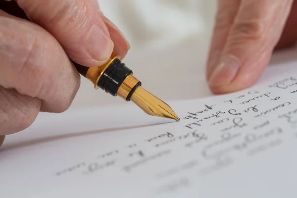 Senior Woman Writing White Sheet — Stock fotografie