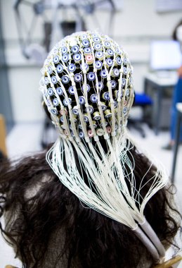 Study of the activity of neurons in the brain by electroencephalography.