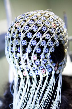 Study of the activity of neurons in the brain by electroencephalography.