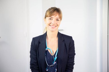 A female doctor talking and listening to a patient.