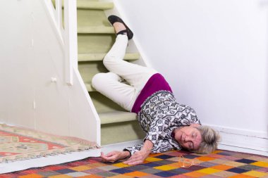 Elderly woman who has fallen down stairs.