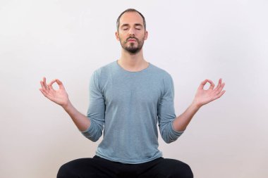 A man carrying out relaxation techniques. .
