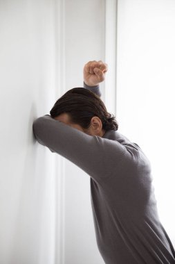 Depressed man on studio background