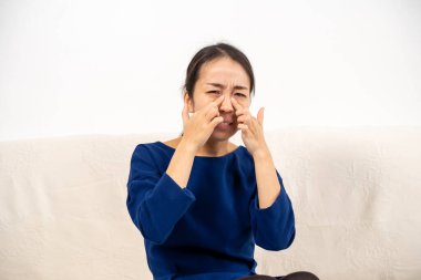 Asian woman in teleconsultation with her doctor