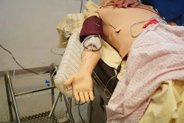 Anesthesiologist students during a critical situation resuscitation exercise at the Nimes Faculty of Medicine. Students train on a Sim Man 3 G robotic dummy.