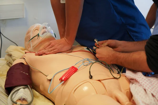 Anesthesiologist students during a critical situation resuscitation exercise at the Nimes Faculty of Medicine. Students train on a Sim Man 3 G robotic dummy.