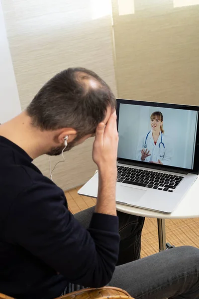 Man Consulting His Doctor Video Consultation — Stok fotoğraf