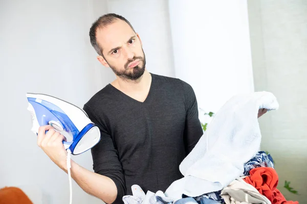 Man Sorting Washing Ironing — Foto Stock