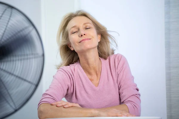 Menopausal Woman Having Hot Flush — Stockfoto