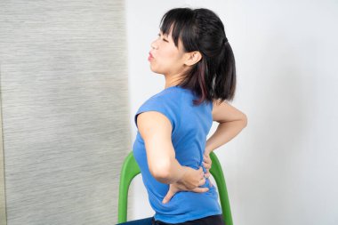 Lower back pain asian woman