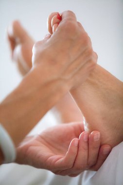 Chinese medicine practice, plantar reflexology session.
