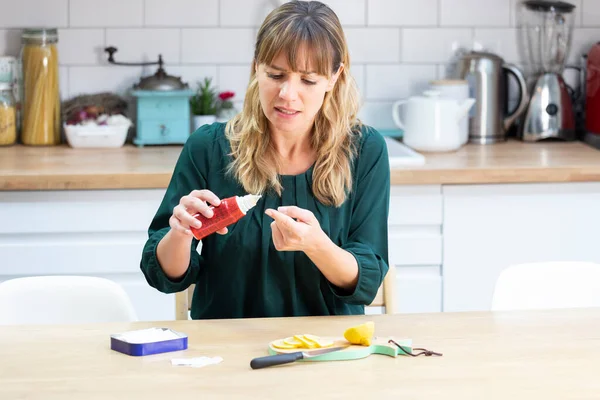 Young Woman Disinfecting Wound Her Finger — Stockfoto