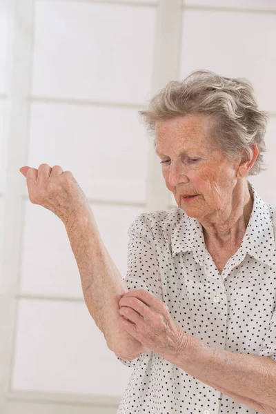 Senior Woman Scratching Herself — 스톡 사진