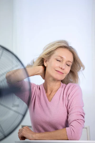 Menopausal Woman Having Hot Flush — Stockfoto