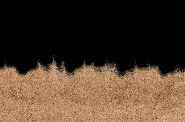 Sanden på den svarta bakgrunden — Stockfoto