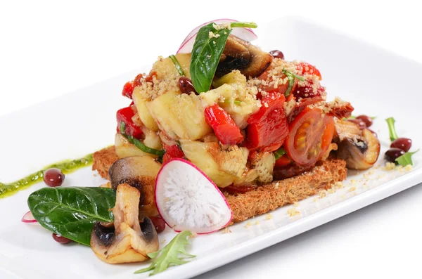 Salad from baked eggplants and peppers with mushrooms grilled bread — Stock Photo, Image