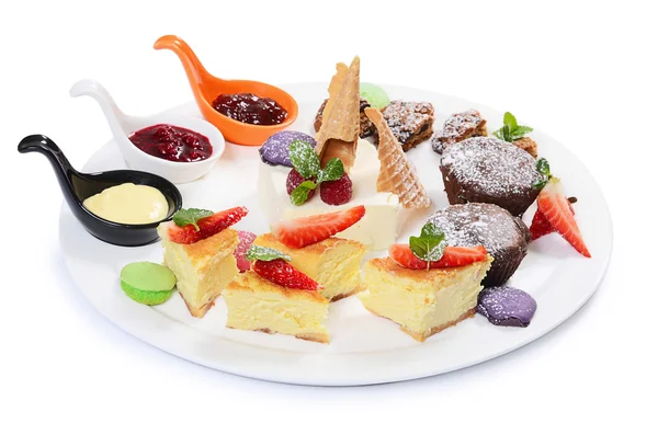 Plate of different desserts isolated — Stock Photo, Image