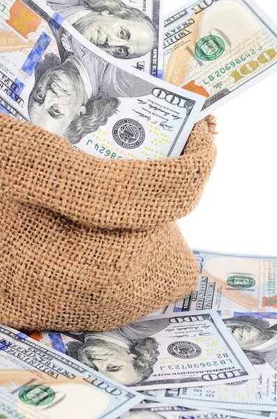 Billetes de dólar en un saco aislado — Foto de Stock