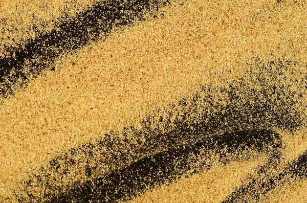 Der Sand auf dem schwarzen Hintergrund — Stockfoto