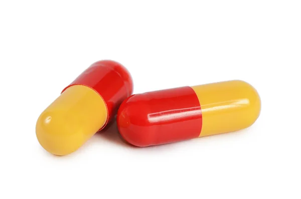 Dos pastillas aisladas sobre fondo blanco — Foto de Stock