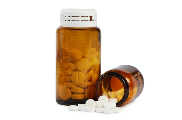 Tabletta-hoz egy üvegedénybe, elszigetelt fehér — Stock Fotó