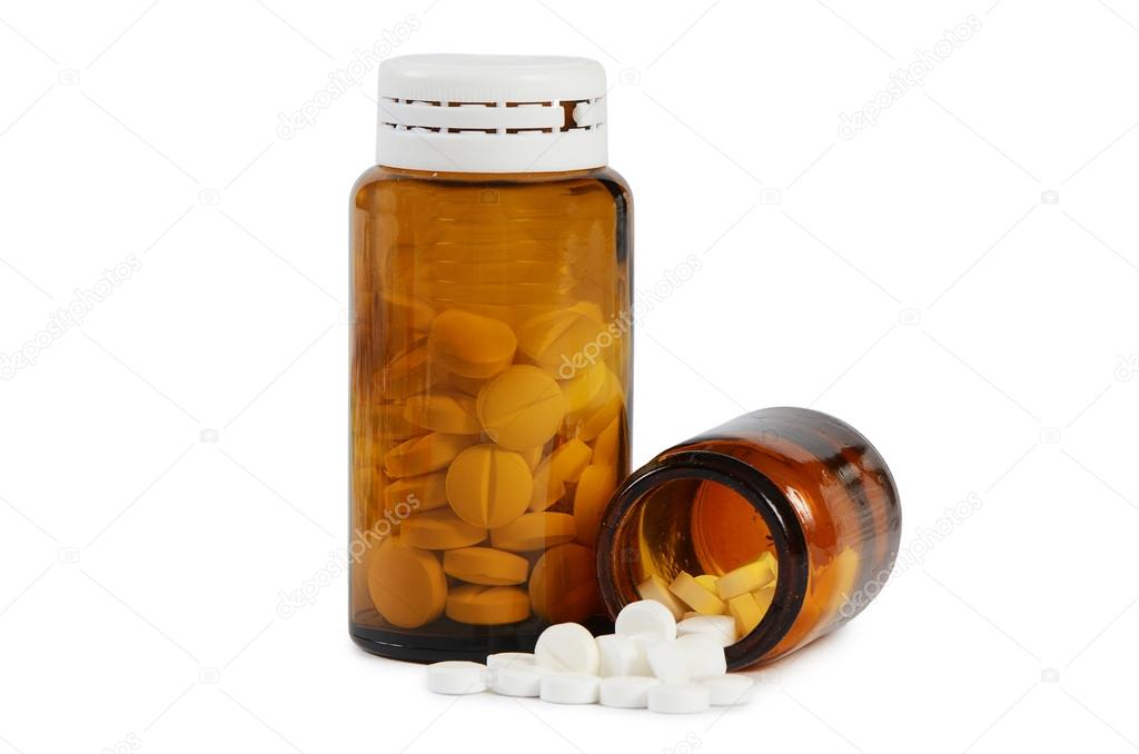 Tablets to a glass jar  isolated on white
