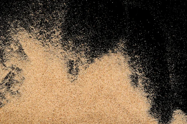 Siyah arka plan üzerine kum — Stok fotoğraf