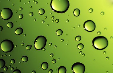 Water drops against a glowing green background clipart