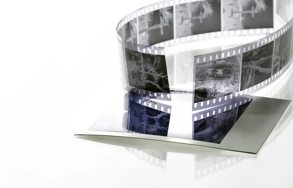 35mm film negative reflected onto instant film — Stock Photo, Image